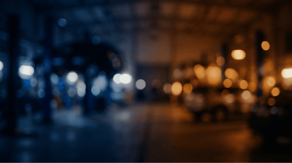 Blurred night view of vehicles outside WeFix Collision Center