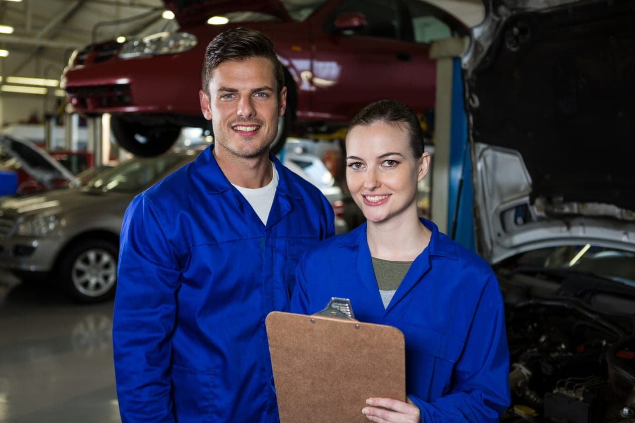 WeFix Collision Center technicians standing together in the repair shop